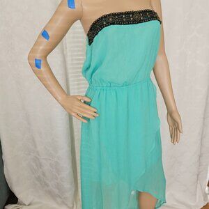 **Elegant Strapless Aqua Dress with Beaded Black Detail** by BEBE